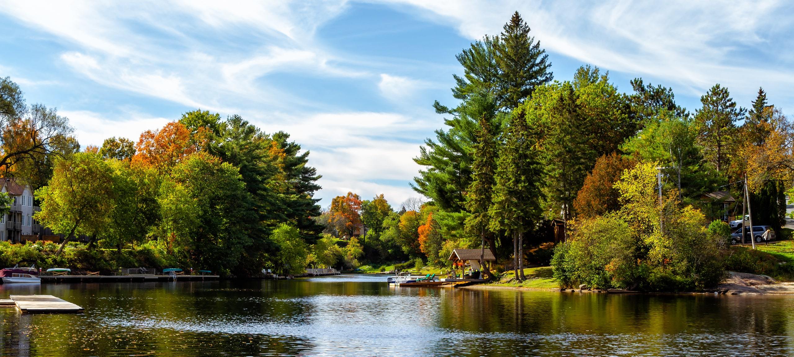 Waterfront homes and autumn trees in Bracebridge, ON