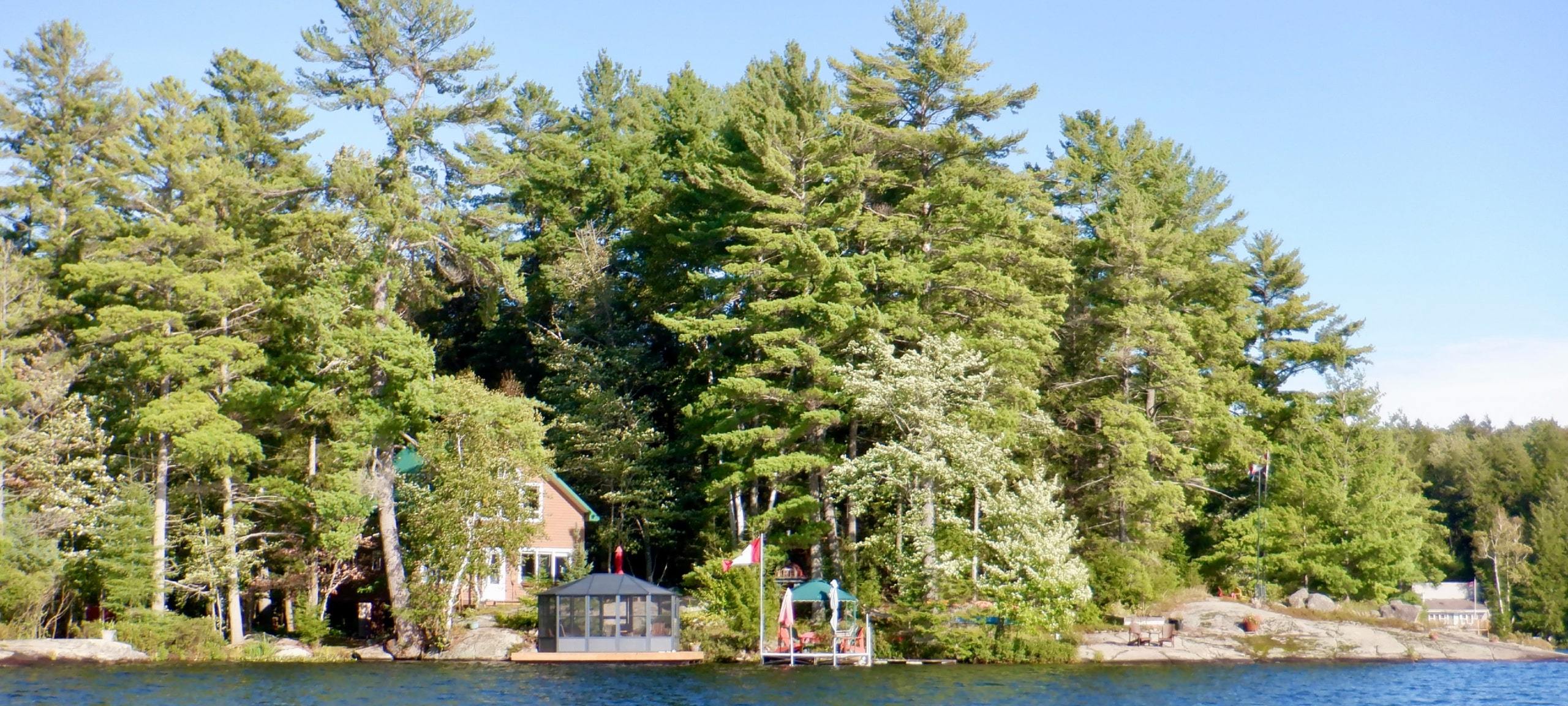 Forested waterfront home with dock in Muskoka, ON