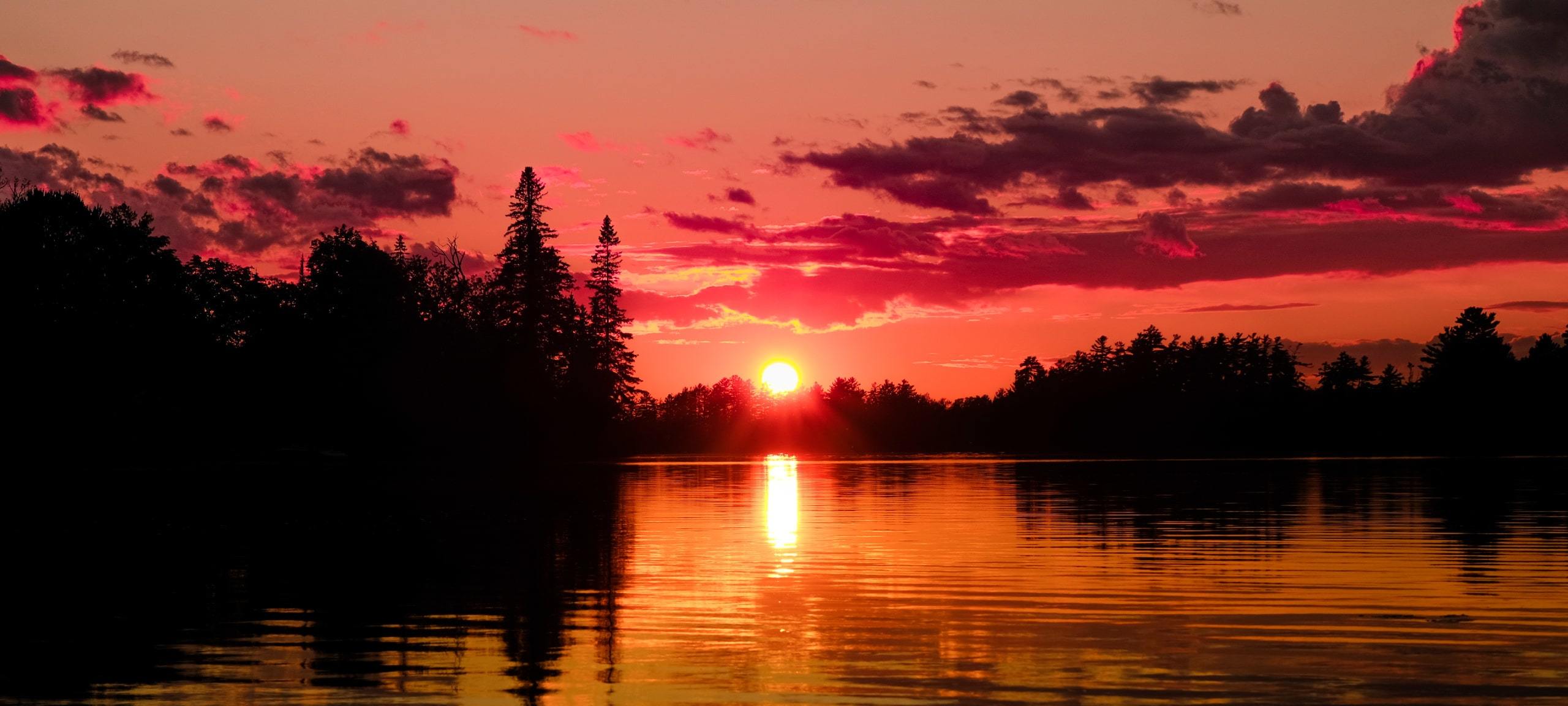 Red sunset over Muskoka lake near Hillside, ON