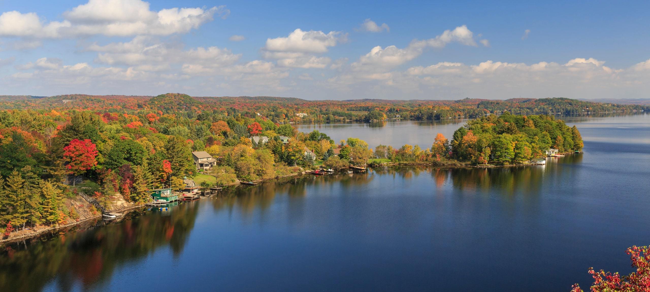 View of Fall colours over Huntsville and Fairy Lake from Lions Lookout